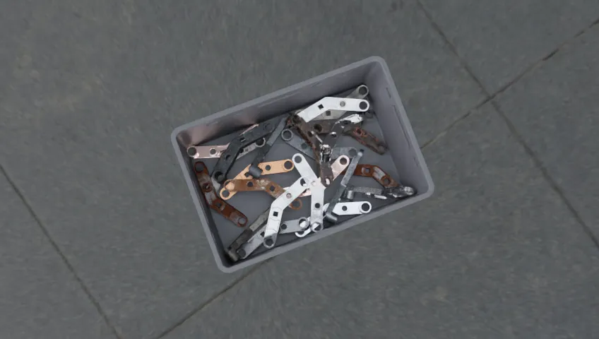 Synthetic render of metallic hinges in an industrial bin